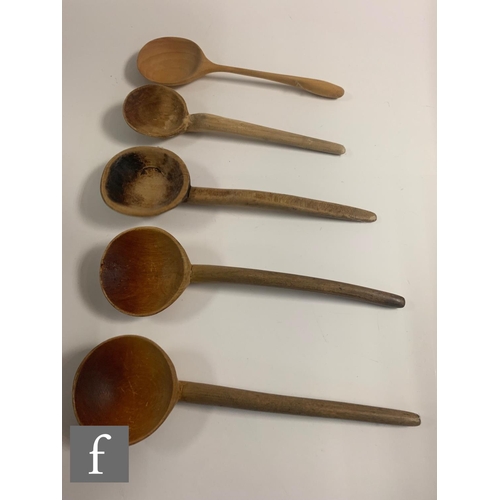 329 - A 19th Century oak Welsh three tier stepped spoon rack with later associated spoons, width 33cm.