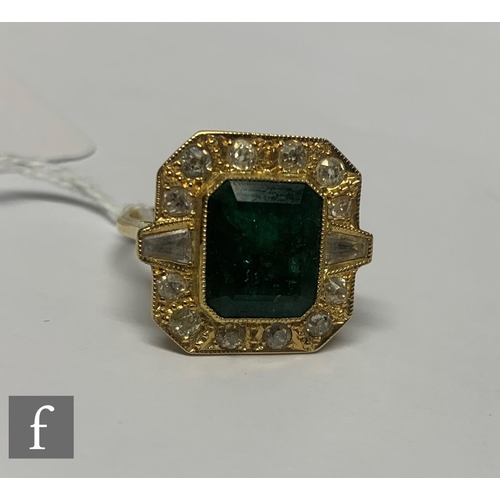 99 - An 18ct hallmarked emerald, diamond and paste set cluster ring, central canted rectangular emerald w... 