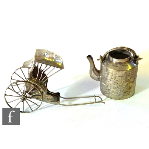 221 - A Chinese silver miniature kettle with engraved landscape decoration, with a similar rickshaw. (2)