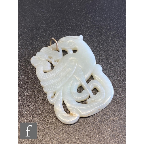 55 - Two carved jade pendants, a circular and a cushioned rectangular example. (2)