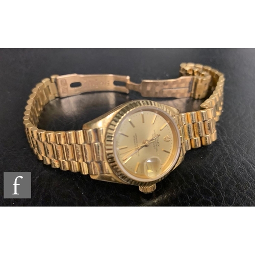 173 - A lady's 18ct Rolex Datejust gilt baton and date facility to a circular champagne dial, case diamete... 