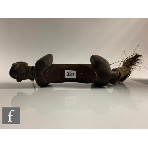 337 - An early 20th Century Ngoni style African tribal head rest with natural string tail and shell collar... 