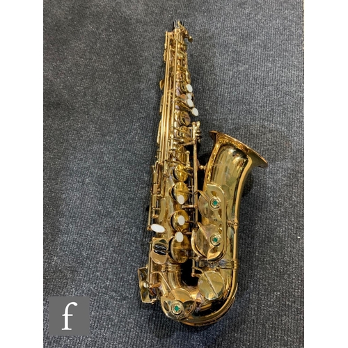 302 - A brass saxophone by Signature series, cased.