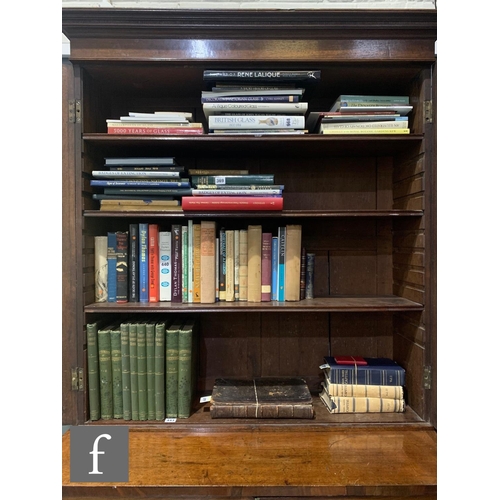 446 - A George III mahogany bookcase enclosed by a pair of diamond bar glazed doors below a fluted cornice... 