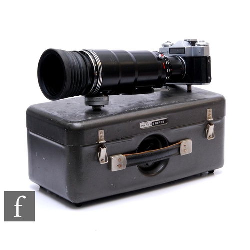 146 - A Zenit ES with Photo Sniper f/4.5 300mm lens with metal photosniper carry case, together with a Nov... 