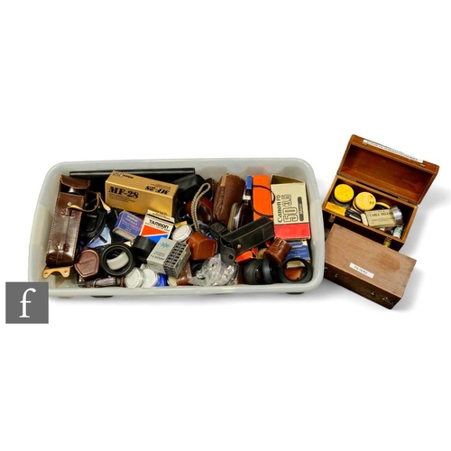152 - A large quantity of various camera accessories including filters, light meters, lens hoods, exposure... 