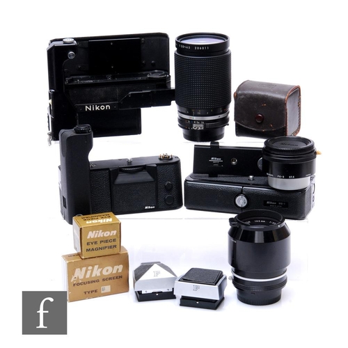 153 - A collection of Nikon camera accessories, to include an F36 motor drive, black, serial number 142054... 