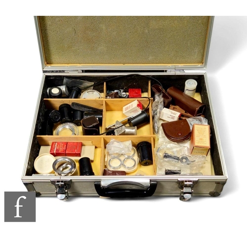 155 - A collection of Leica and Contaflex camera related accessories, to include lens mounts, spools, rang... 