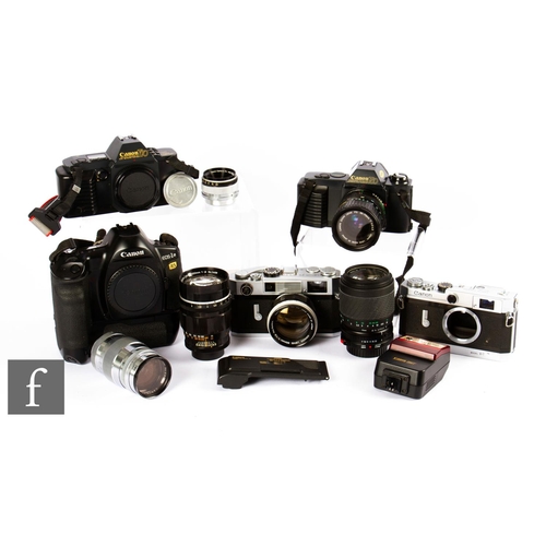 61 - A group of Canon cameras, to include Canon EF outfit, a Canon 7S, to include two camera bodies, thre... 