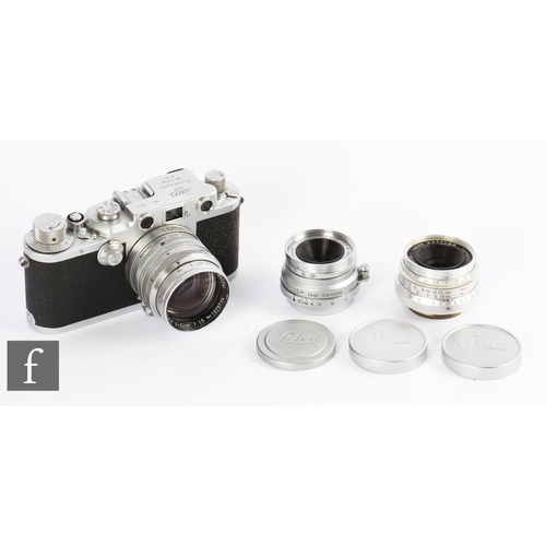 82 - A Leica IIIc, circa 1950, serial number 511024, with Summarit 50mm f/1.5, and additional lenses, Sum... 