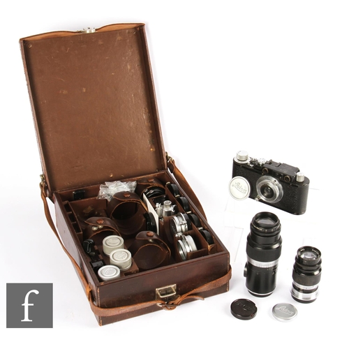 84 - A Leica III set, comprising camera body, various lenses and accessories in fitted case.