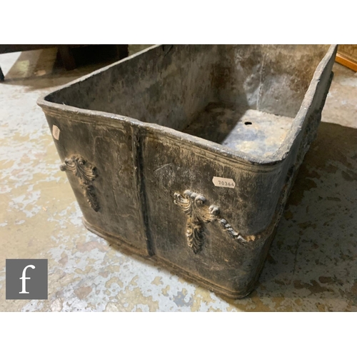 480 - A 19th Century or later rectangular lead planter, the side applied with swags and recumbent lions, h... 