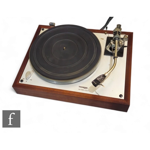 534 - A Thorens TD160 super record player, with spare Goldring G1040 stylus and additional belt, perspex l... 