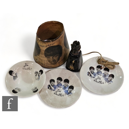 395 - A group of Beatles collectibles to include an original 1960s lamp shade and two Beatles plates and a... 