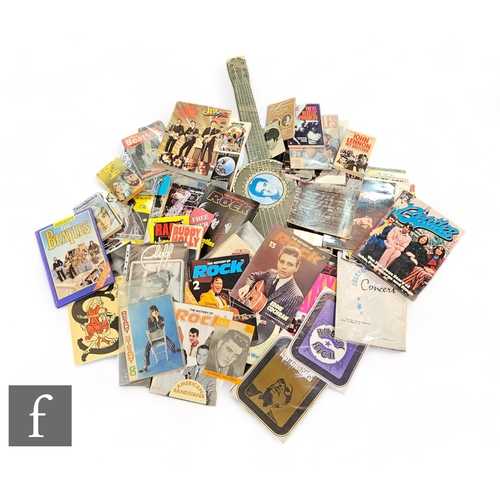 396 - A collection of various Beatles related collectible items to include books, original postcards, shee... 