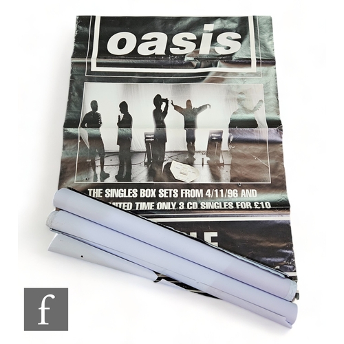 397 - A collection of four Oasis large format record store album teaser music posters, together with a 200... 