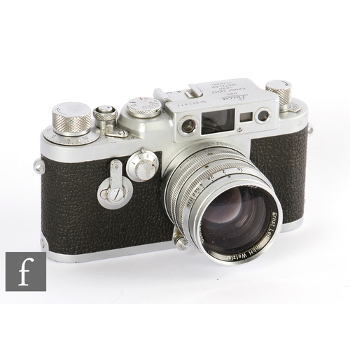161 - A Leica IIIg, 1959, chrome, with Summarit 50mm f/1.5 lens, red dial, with leather case.