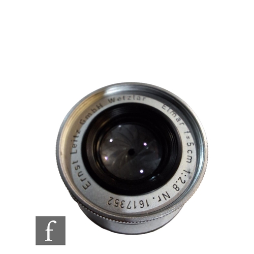 102 - Two Leica lens, to include a Summarex 85mm f/1.5 lens, serial number 1008917, rear and lens cap, and... 