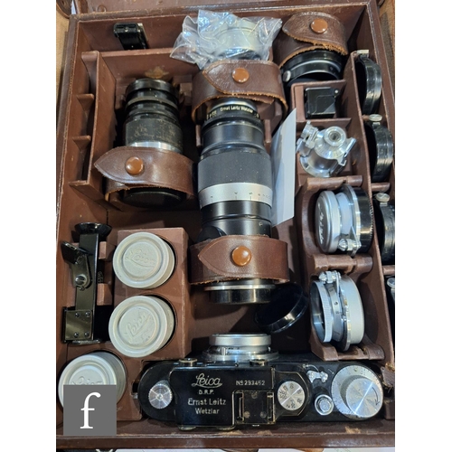 84 - A Leica III set, comprising camera body, various lenses and accessories in fitted case.