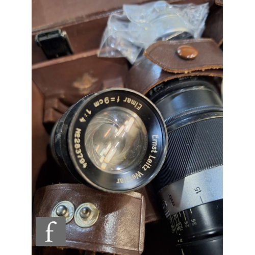 84 - A Leica III set, comprising camera body, various lenses and accessories in fitted case.