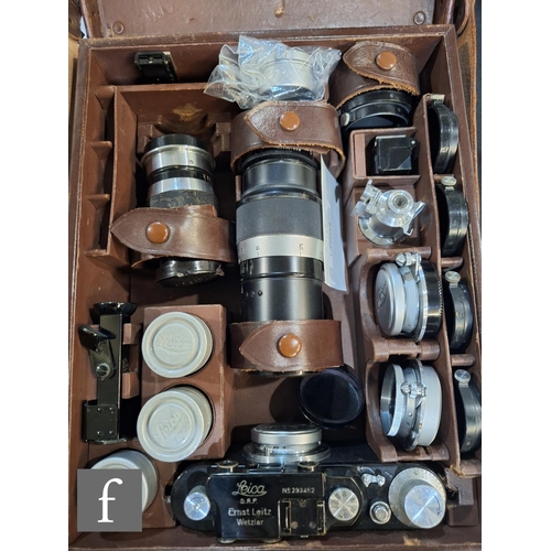 84 - A Leica III set, comprising camera body, various lenses and accessories in fitted case.