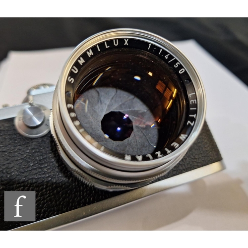 85 - A Leica IIIf camera outfit, camera serial number 661171, with Leitz Summilux f1.4 50mm lens serial n... 