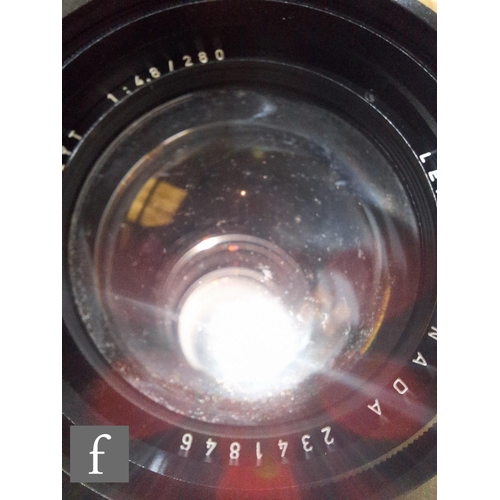 138 - A collection of Leica camera lenses to include Leica f4.8 280mm Teylt telephoto lens, serial number ... 