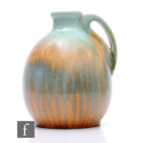 104 - Ruskin Pottery - A large 1930s pottery jug of ovoid form with narrow collar neck and stylised tear d... 