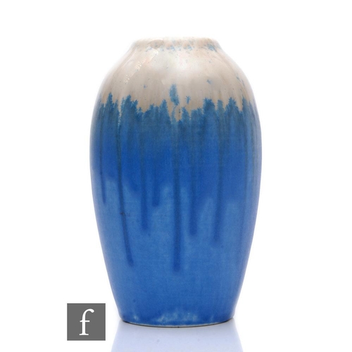 105 - Ruskin Pottery - A 1930s pottery vase of ovoid form with a crystalline glaze in streaked white throu... 