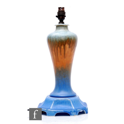 109 - Ruskin Pottery - A large 1930s pottery table lamp, the fluted octagonal footed base mounted with a b... 