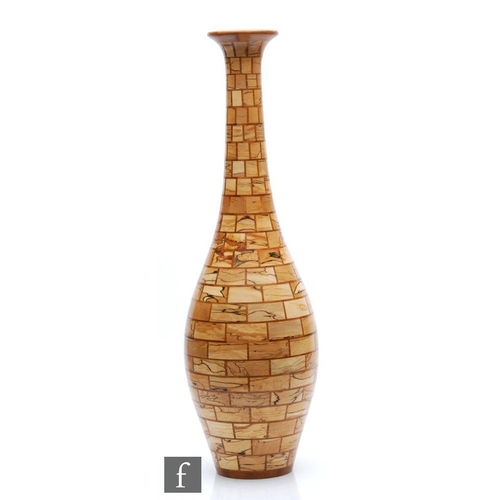 1112 - Bill Robinson - A contemporary segmented woodturned vase of ovoid form with tall collar neck and fla... 