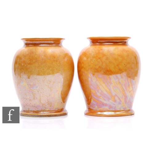 112 - Ruskin Pottery - A pair of 1930s Pottery vases, each of footed shouldered ovoid form with everted ri... 