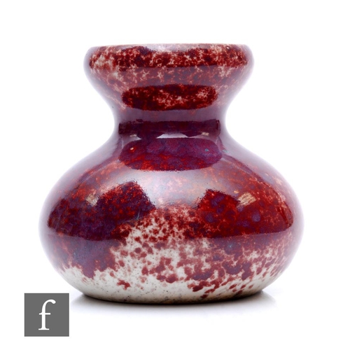 129 - Ruskin Pottery - A 1930s pottery vase of double gourd form decorated in a high fired glaze with purp... 