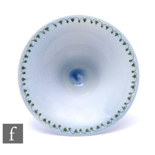 130 - Ruskin Pottery - A large egg shell pottery bowl of flared circular form, raised to a shallow stem an... 