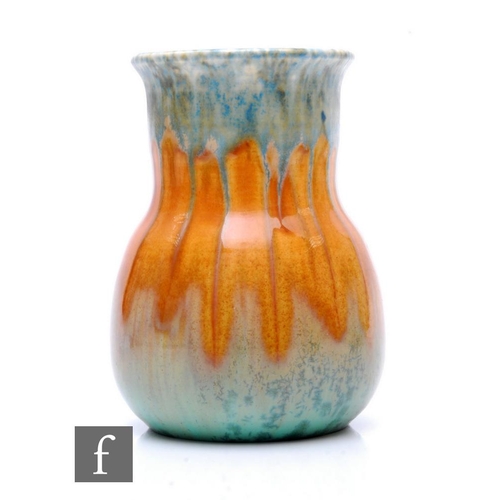 145 - Ruskin Pottery - A 1930s pottery vase of low shouldered form with collar neck and everted rim, decor... 