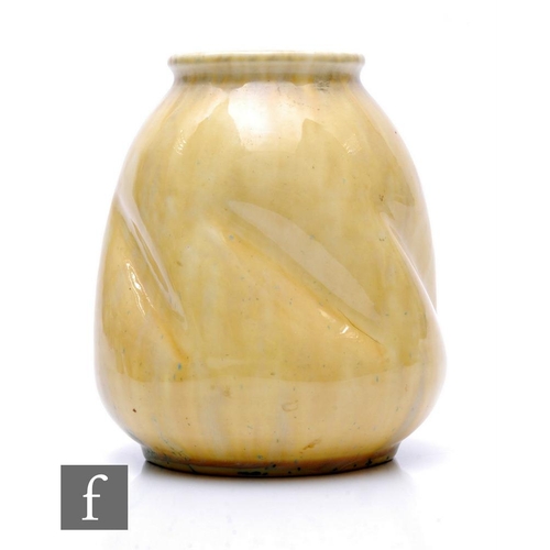 154 - Ruskin Pottery - A 1930s pottery vase of tapered ovoid form with everted collar neck, decorated with... 