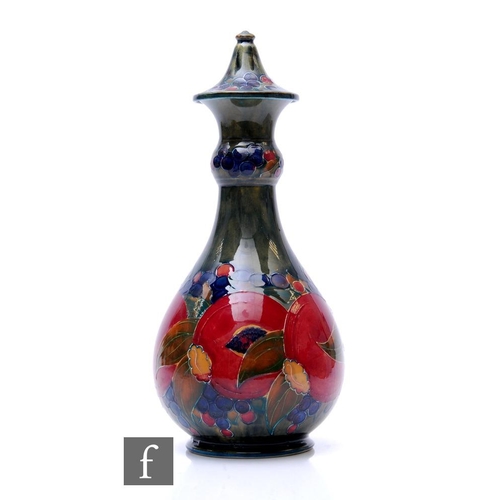 179 - William Moorcroft - Ochre Pomegranate - A shape 24 vase circa 1914, of footed globe and shaft form w... 