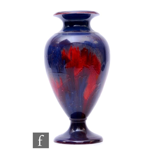 185 - William Moorcroft - A large pedestal vase circa 1915/20, the footed shouldered ovoid body rising to ... 