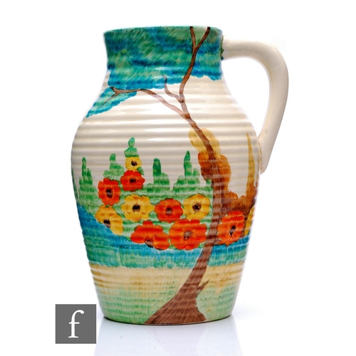 247 - Clarice Cliff - Sandon - A single handled Lotus jug circa 1933, hand painted with a stylised tree an... 