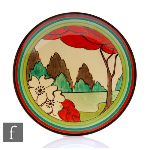 259 - Clarice Cliff - Limberlost - A circular dish form plate circa 1932, hand painted with a stylised tre... 