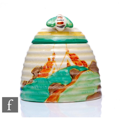 275 - Clarice Cliff - Secrets - A large beehive honey pot circa 1933, hand painted with a stylised tree an... 