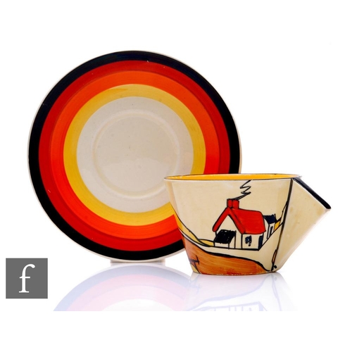 303 - Clarice Cliff - House & Bridge - A Conical tea cup and saucer circa 1931, hand painted with a st... 