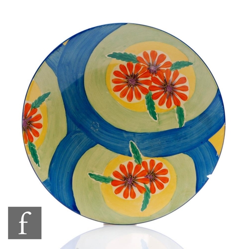 390 - Clarice Cliff - Blue Ribbon - A circular dish form plate circa 1932, hand painted with sprays of flo... 