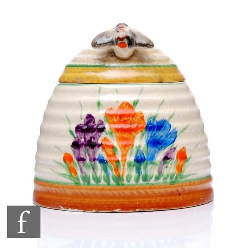 414 - Clarice Cliff - Crocus - A large Beehive shape honey pot circa 1931, hand painted with Crocus sprays... 