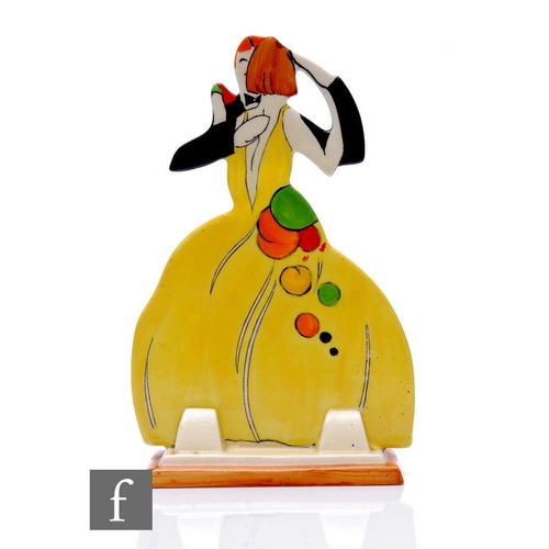 Clarice Cliff - Age of Jazz - A figural group modelled as a couple dancing, him in black tie and tails, her in a yellow ballgown with brightly coloured detail, Bizarre mark, height 19cm.