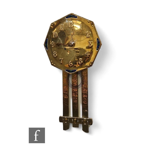 63 - Unknown - An early 20th Century brass wall clock, the octagonal face with repousee numbers with four... 