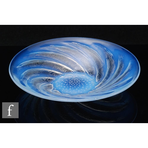 654 - Rene Lalique - Poissons No 1 - An opalescent glass dish circa 1931, relief moulded with spiralling f... 