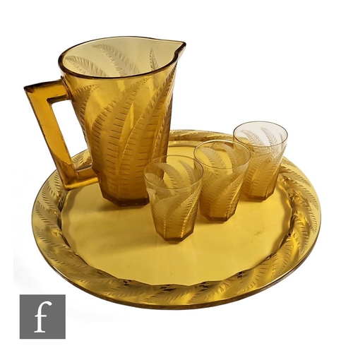 659 - Rene Lalique - A 1930s Hesperides part drinking suite, comprising large jug, three tumblers and a la... 