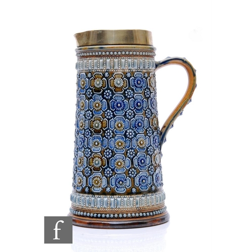 97 - Doulton Lambeth - A large water jug of tapered cylindrical form, heavily decorated with repeat styli... 