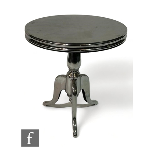 1121 - Eichholtz - A nickel finish bistro style table, raised on a tripod baluster base with circular plain... 